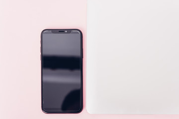 Top view of modern technology smart phone mobile and computer laptop close cover