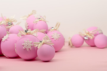 Fototapeta na wymiar Flat lay, Christmas spheres, pink and white background, Xmas and New Year holiday