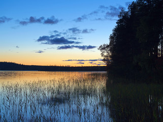 Beautiful lakeside view in Finland at sunset