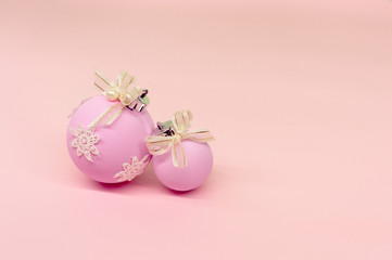Flat lay, Christmas spheres, pink and white background, Xmas and New Year holiday