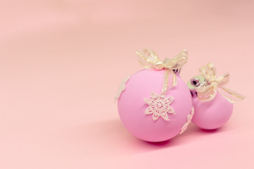 Flat lay, Christmas spheres, pink and white background, Xmas and New Year holiday