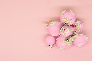 Flat lay, Christmas spheres, pink and white background, Xmas and New Year holiday