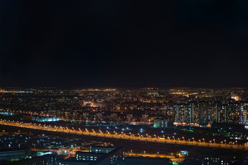 Fototapeta na wymiar Night cityscape from high altitude