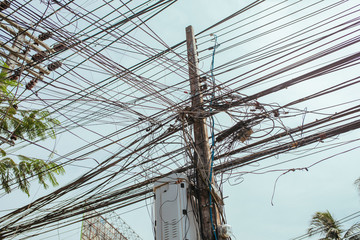 Wires on poles on the street in Asia, Thailand