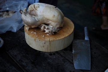 Fototapeta na wymiar Boiled chicken breast on wooden cutting board