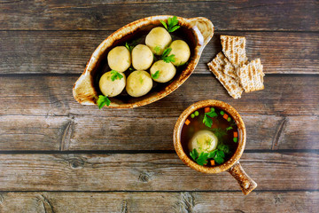 Delicious matzoh ball soup with dill, parsley and carrots.