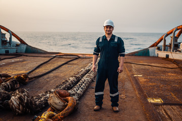 Marine Deck Officer or Chief mate on deck of offshore vessel or ship , wearing PPE personal...