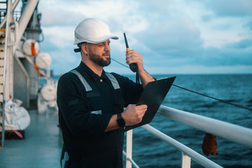 Marine Deck Officer or Chief mate on deck of offshore vessel or ship , wearing PPE personal...