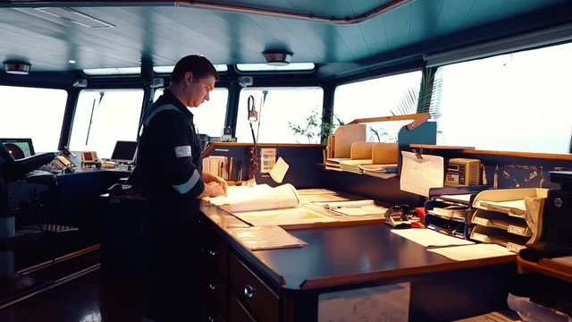 Marine navigational officer during navigational watch on Bridge . He does chart correction of nautical maps and publications. Work at sea