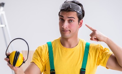 Worker showing the importnace of wearing noise cancelling headph