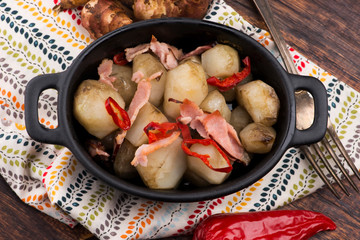 Jerusalem artichoke au gratin with ham and chili. Fricassee, fruits