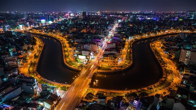 Trident shaped cityscape with traffic in Ho Chi Minh City, Vietnam time lapse at night