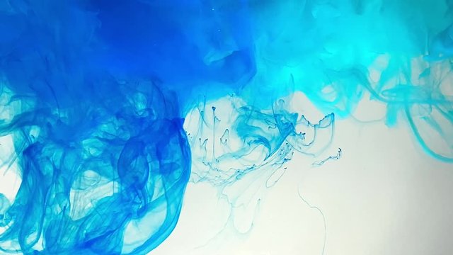 Blue smoke. Abstract blue marine background. Stylish background. Blue watercolor ink on a white background. Smooth movement of acrylic ink. Amazing trending background.