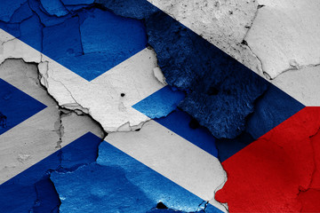 flags of Scotland and Czech Republic painted on cracked wall