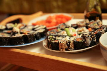 table with a set of rolls and sauce