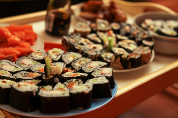 table with a set of rolls and sauce