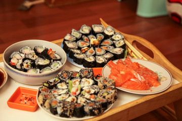 table with a set of rolls and sauce