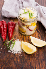 Preserved Lemons with salt on a wooden board