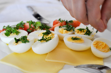 Food styling eggs with fresh herbs