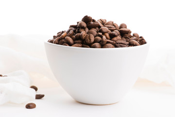 Bowl of caffee beans on a white background