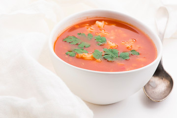 Tomato soup with rice decorated with parsley