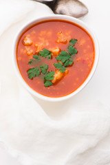 Tomato soup with rice decorated with parsley
