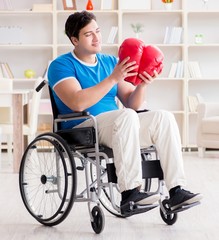 Disabled boxer at wheelchair recovering from injury