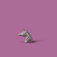 Concrete unicorn statue on purple background . Minimal concept. 3d rendering