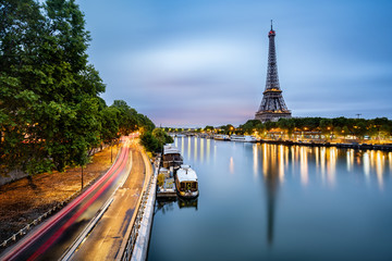 Paris cityscape taken at dawn with the Eiffel tower and the boats reflected on the Seine river, Paris, France - obrazy, fototapety, plakaty