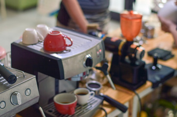 Obraz na płótnie Canvas Blurry image top of espresso coffee machine on barista counter