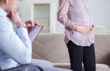 Pregnant woman visiting psychologist doctor