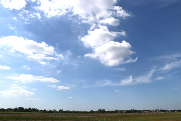 green field and blue sky