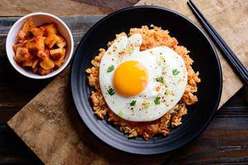Kimchi fried rice with fried egg on top, Korean food, top view