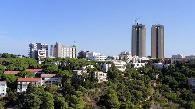 Aerial footage of Haifa, Israel, showing houses on central Carmel area with Haifa bay in the background
