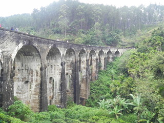 Fototapeta na wymiar old stone bridge. This is called The Nine Arch of Sri Lanka. This is called as Bridge in the sky also.