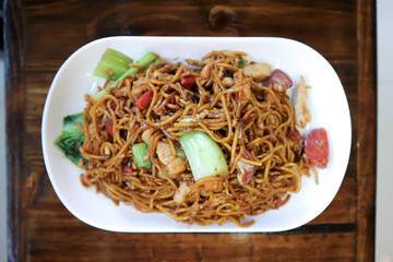 stir-fried noodles with pork, sausage and vegetable