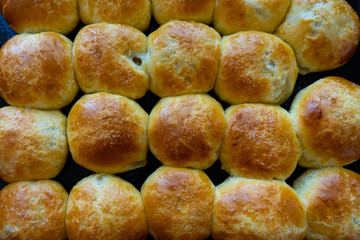 Baked hot buns. Sweet buns on a baking sheet