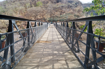 Fototapeta premium Bridge above the Waghur River at the Ajanta Caves. Maharashtra State of India
