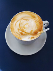 cup of coffee on dark blue background