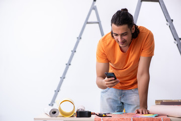 Young man contractor doing renovation at home