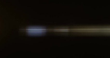 Yellow Anamorphic Flares on Black Background Shot on Red and Lomo 35mm Lens Wide Open