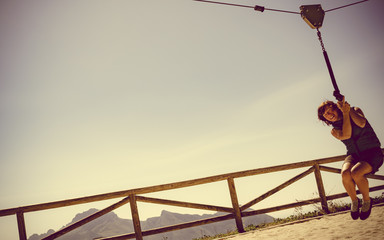 Adult woman having fun on zipline