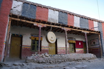 A sacred gong hangs in the courtyard in Tsarang Gompa (1395) - Sakya Monastery. Trekking to the...