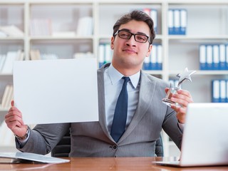 Businessman in office holding a blank message board