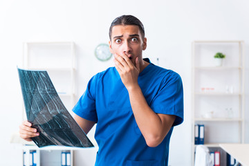Young male doctor working in the clinic