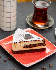 creamy dessert and black tea served in armudu glass