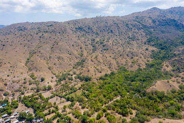 Obraz premium Aerial view of typical village on small island in Komodo National Park, Nusa Tenggara, Indonesia. Komodo National Park is home to about 3500 people.