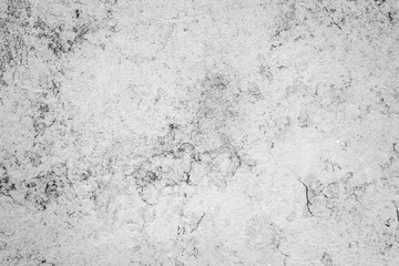 Texture of a concrete wall with cracks and scratches which can be used as a background