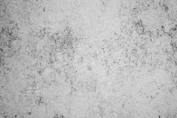 Texture of a concrete wall with cracks and scratches which can be used as a background