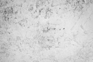Texture of a concrete wall with cracks and scratches which can be used as a background